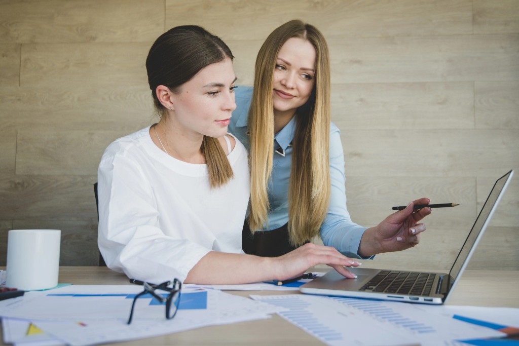 Ecommerce accounting advisers reviewing online business reports